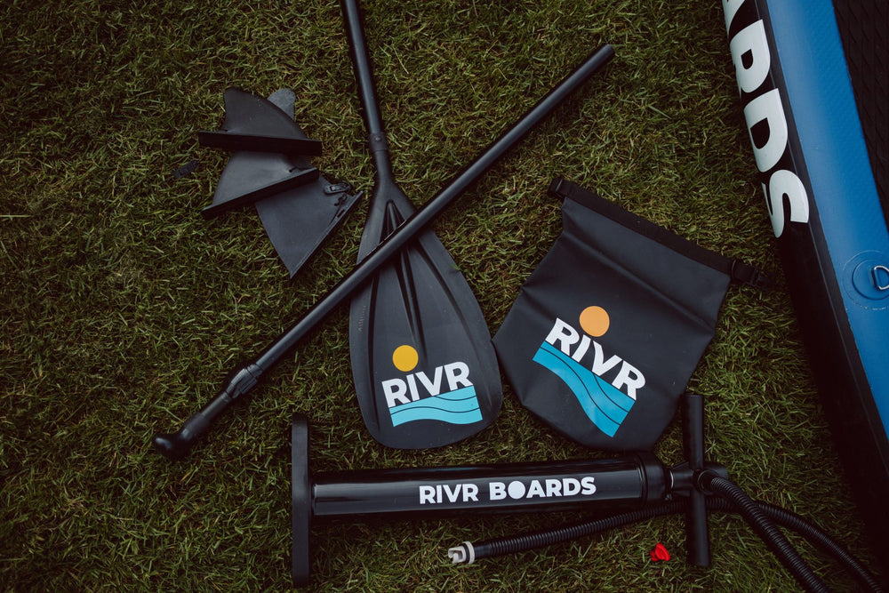 RIVR paddle board paddle, fins, pump, and dry bag